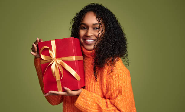 istock african american girl with gift box 1480981874