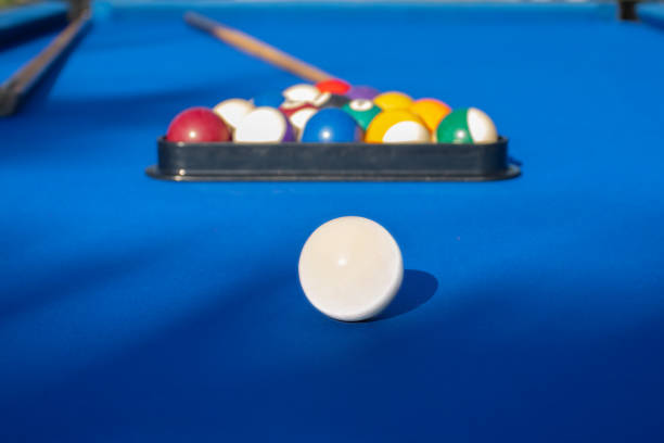 istock pool game, billiard table with balls and a cue, billiard sport 1480982445