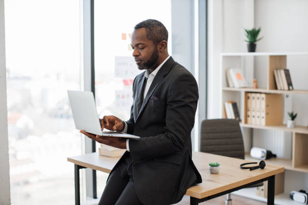 istock Male employer checking emails on modern laptop at work 1480983130