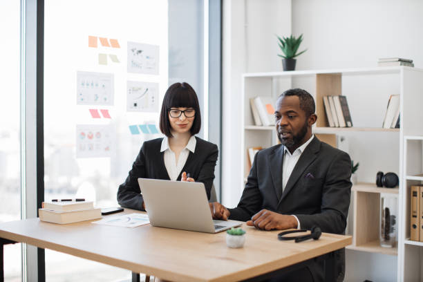 istock Diverse office workers having video call on laptop at office 1480983620