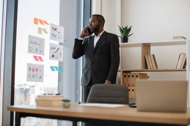 istock Employer having conversation on cell phone in workplace 1480983695