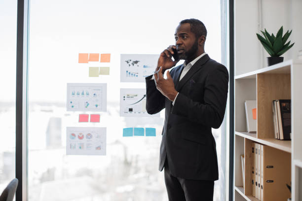 istock African businessman talking on smartphone in office room 1480983712