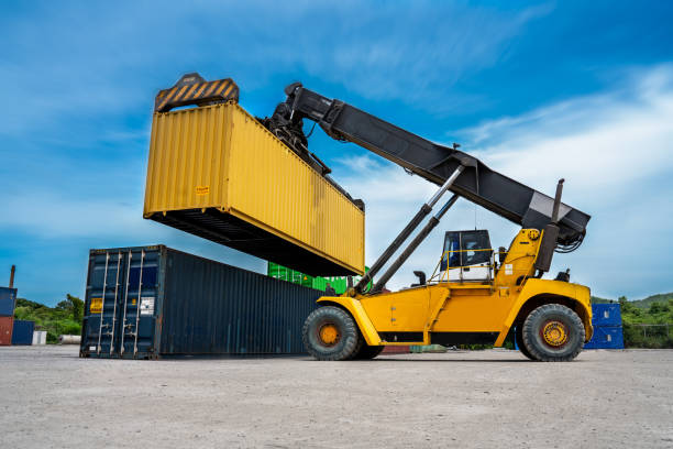 istock Forklift Truck working in the container cargo yard port loading cargo tank logistic service and transportation concept. forwarder mast 1480986321