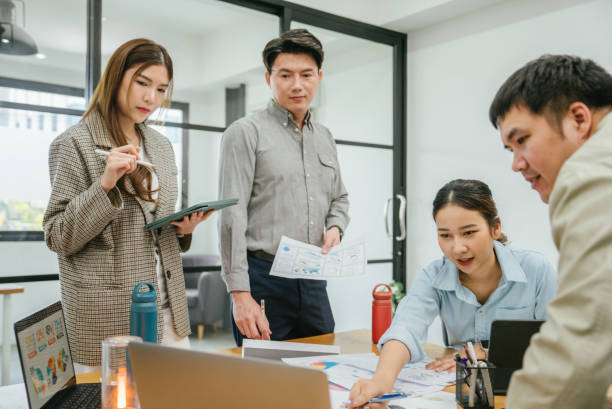 istock Asian businessman company member explaining project details to diverse team. 1480988251