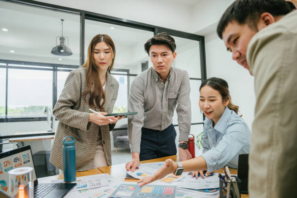 istock Asian businessman company member explaining project details to diverse team. 1480988265