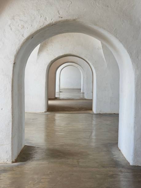 istock Arches corridor in old house 1480988370