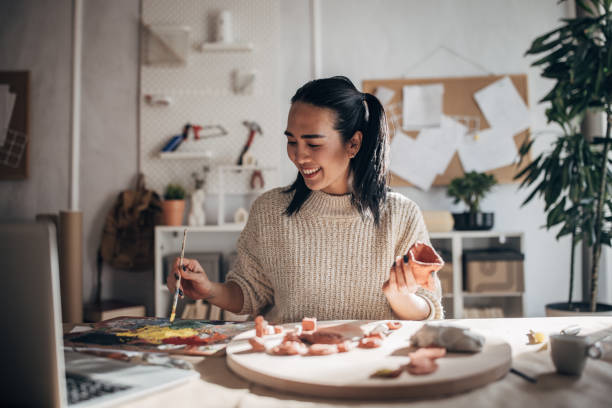 istock Creative woman painting clay 1480989167