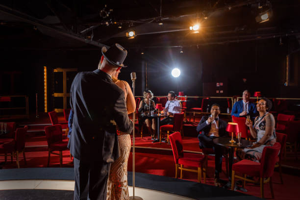 istock Beautiful couple of performers singing on stage 1480989678