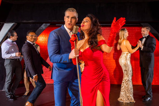 istock Beautiful couple of performers singing on stage 1480990832