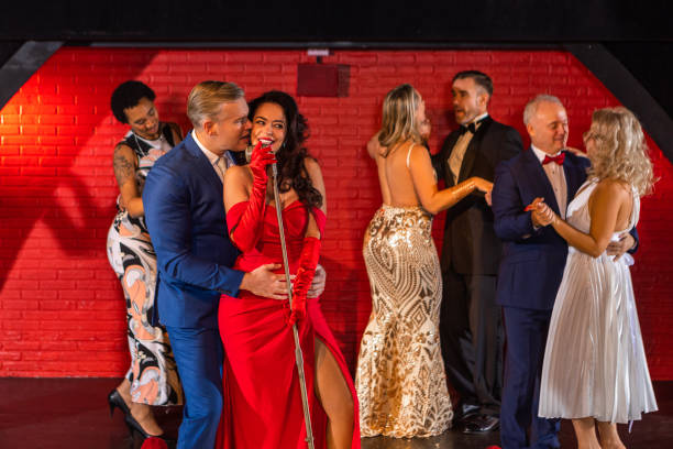 istock Beautiful couple of performers singing on stage 1480990849