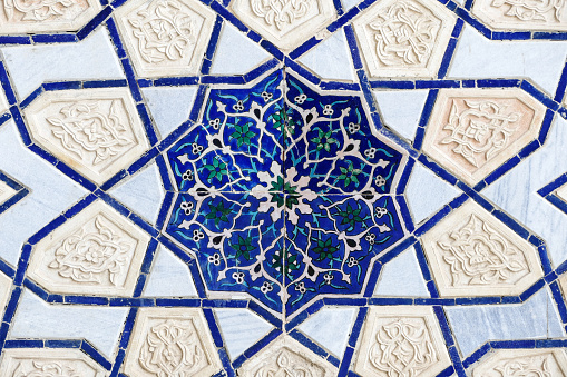 Ancient oriental ornament of wall of old building in Samarkand, Uzbekistan