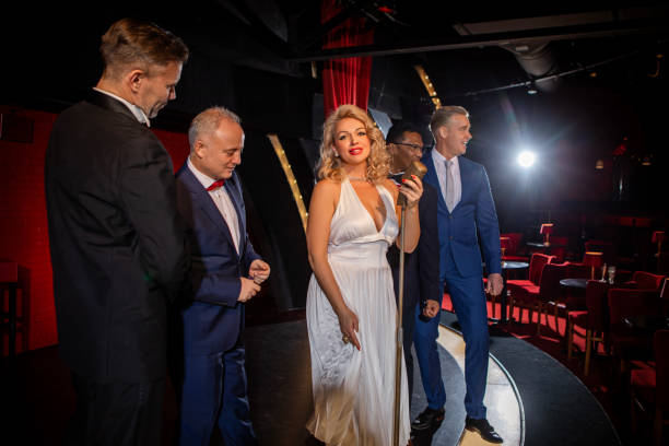 istock Beautiful couple of performers singing on stage 1480991097