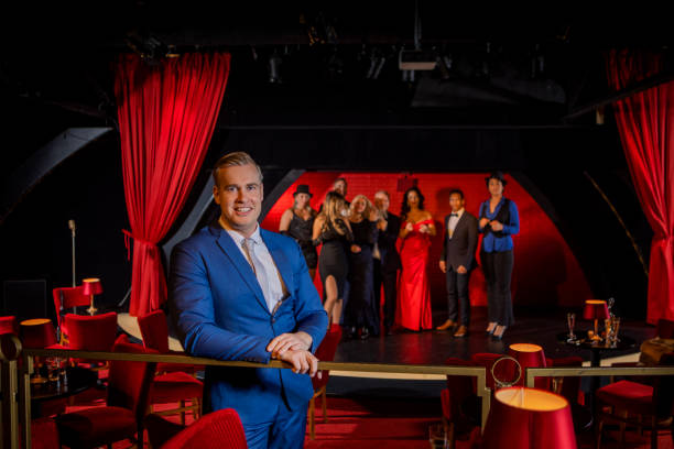 istock Handsome male singer on stage in front of an audience 1480991275