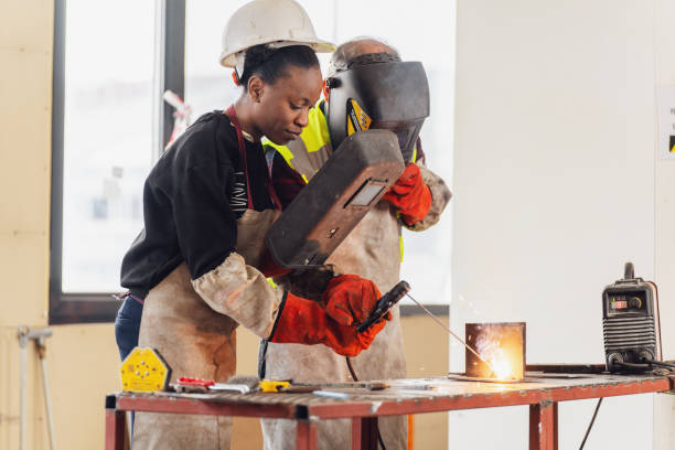 istock Young Woman Learning to Weld 1480992944