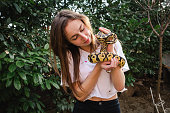 Young woman and her pet snake