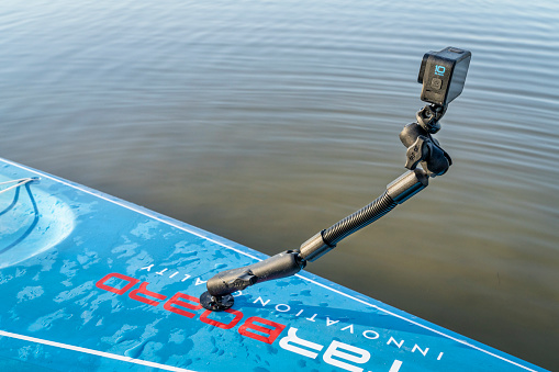 Fort Collins, CO, USA - April 6, 2023: GoPro 10 action camera mounted on a deck of stand up paddleboard (2023 Waterline model by Starboard).