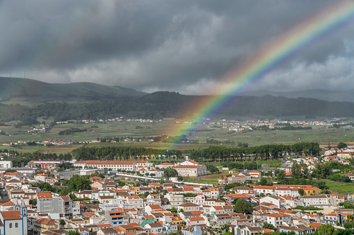 High angle view of Ponta Delgada - San Miguel island, Azores. On sunny day and rainbow over the city.