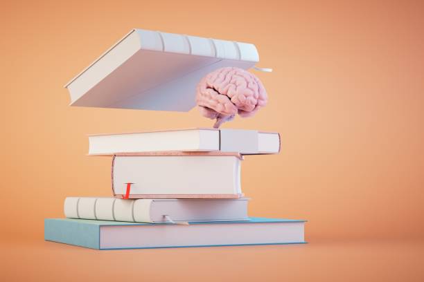 istock the concept of continuous learning. a stack of books and a brain on a pastel background. 3D render 1481002164
