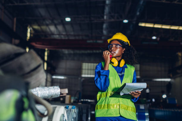 istock Foreman or worker work at factory site check up machine or products in site. 1481009954