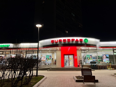 Moscow, Russia - April 08, 2023: EUROSPAR supermarket at night in a residential district