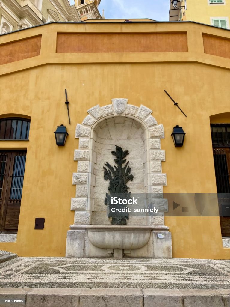 France - Côte d’Azur - Menton- wall with a fountain in the old town France Stock Photo