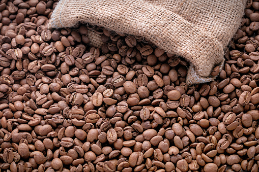 Roasted Coffee Beans in Sack. Stock photo