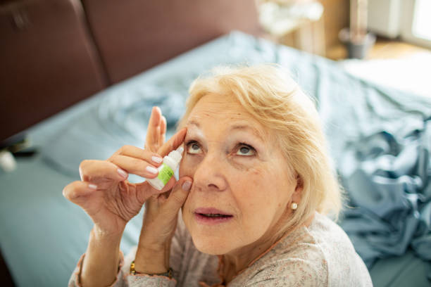 istock Senior woman using eye drops in the bedroom 1481022086
