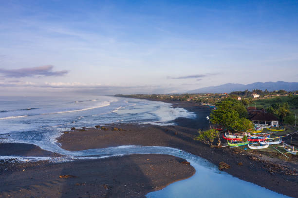 Black sand beach of Medewi in West Bali in Indonesia.