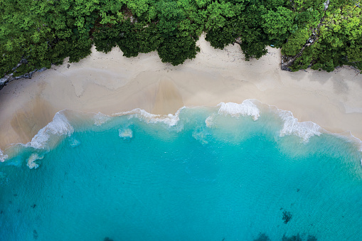 Abstract view of an idyllic white sand beach in Indonesia.