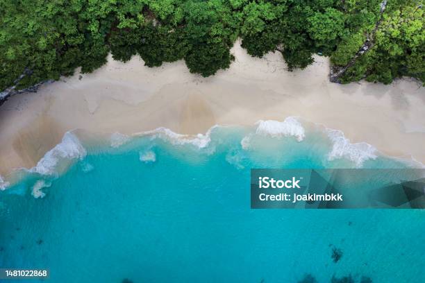 Idyllic White Sand Beach In Bali Indonesia Stock Photo - Download Image Now - Wave Pattern, Wave - Water, Beach