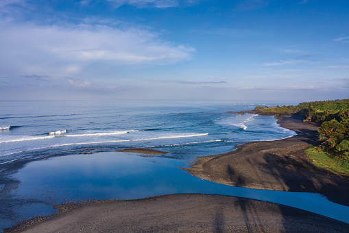 Black sand beach of Balian located in West Bali in Indonesia.