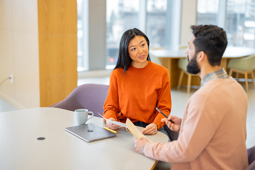 Woman Professional Hr Interviews A Candidate For A Vacancy In The Office At The Workplace. - stock photo