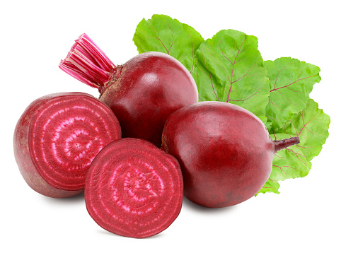 sliced beetroot with green leaves isolated on white background. clipping path