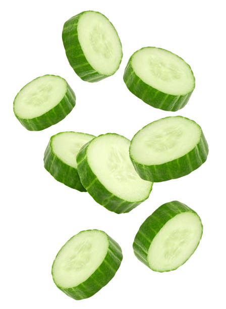 istock flying sliced cucumbers isolated on white background. clipping path 1481024410