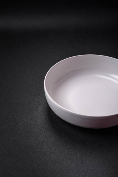 istock White empty soup bowl on a dark concrete background 1481025231