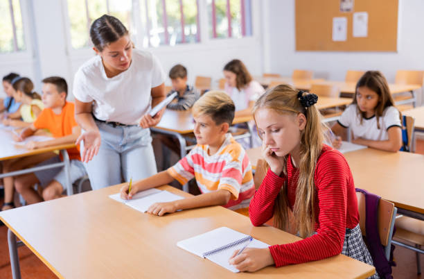 istock Boy and girl studying in classroom 1481031814