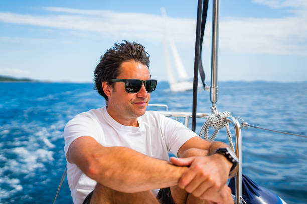 istock Man enjoying sailing with sailboat 1481031843