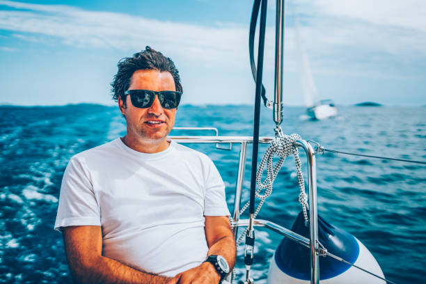 istock Man enjoying sailing with sailboat 1481031858