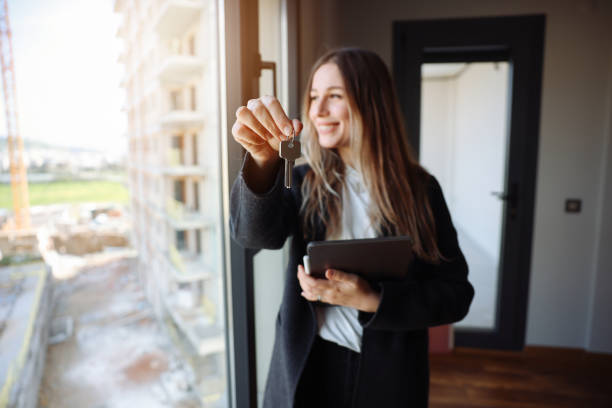 istock Happy Real Estate Agent showing a property 1481033056