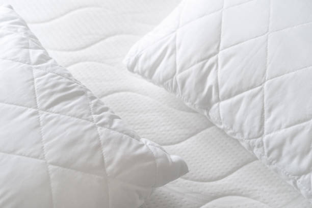 istock background of soft pillows on white quilted mattress 1481035342