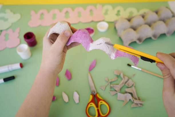 istock Step by step instruction white bunnies made of cardboard packaging from eggs. Zero waste concept. Easter crafts. Step 2 - painting 1481036443