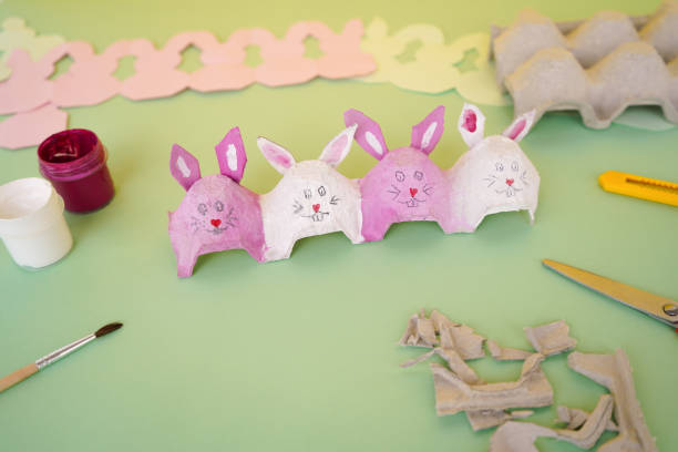 istock DIY pink and white bunnies made of cardboard packaging from eggs. Zero waste concept. Easter crafts 1481036456