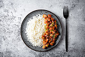 Sweet and sour chili sauce chicken with rice in a plate