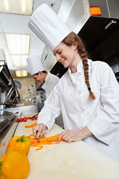 istock Female chef working hard in restaurant commercial kitchen 148104257