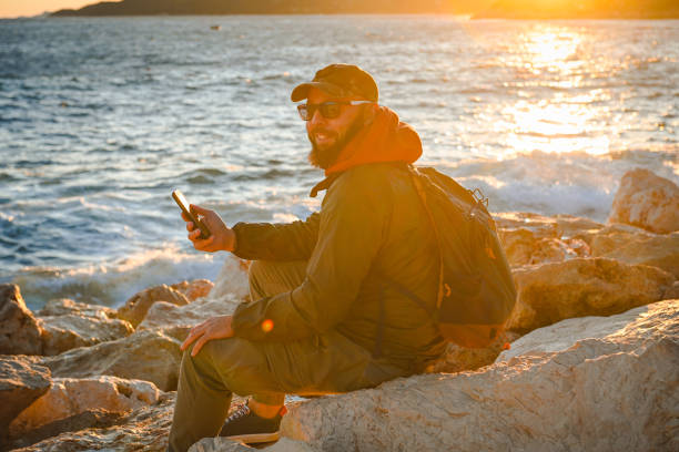 istock man traveling the world (with mobile phone) 1481042597