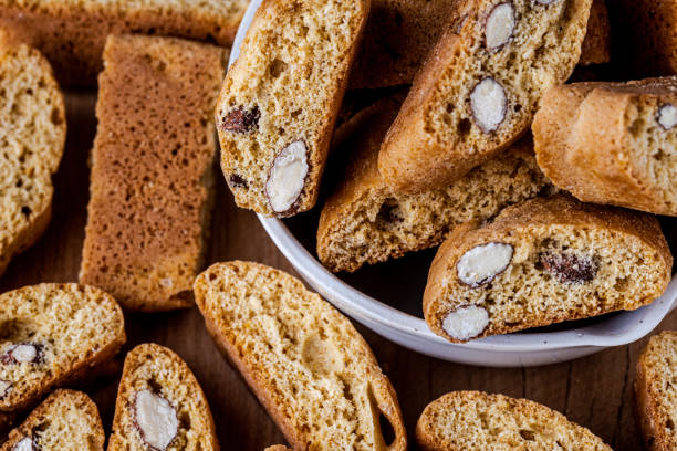 closeup of freshly baked italian almond cantuccini biscuits. - biscotti imagens e fotografias de stock
