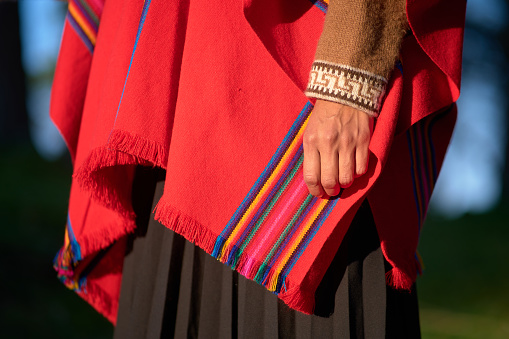 Cropped photo with close up view of the traditional dress of an indigenous woman