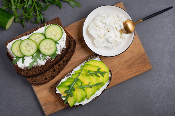 istock Healthy sandwich with white cottage cheese, avocado, cucumber and arugula 1481057049