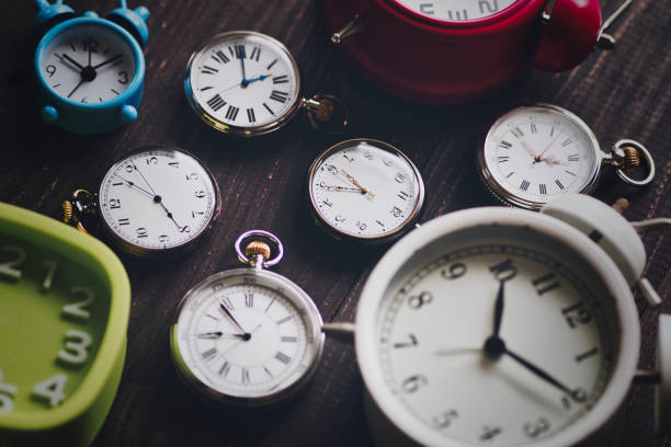 istock pocket watch and alarm clock 1481058599