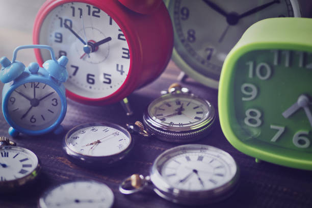 istock pocket watch and alarm clock 1481058605